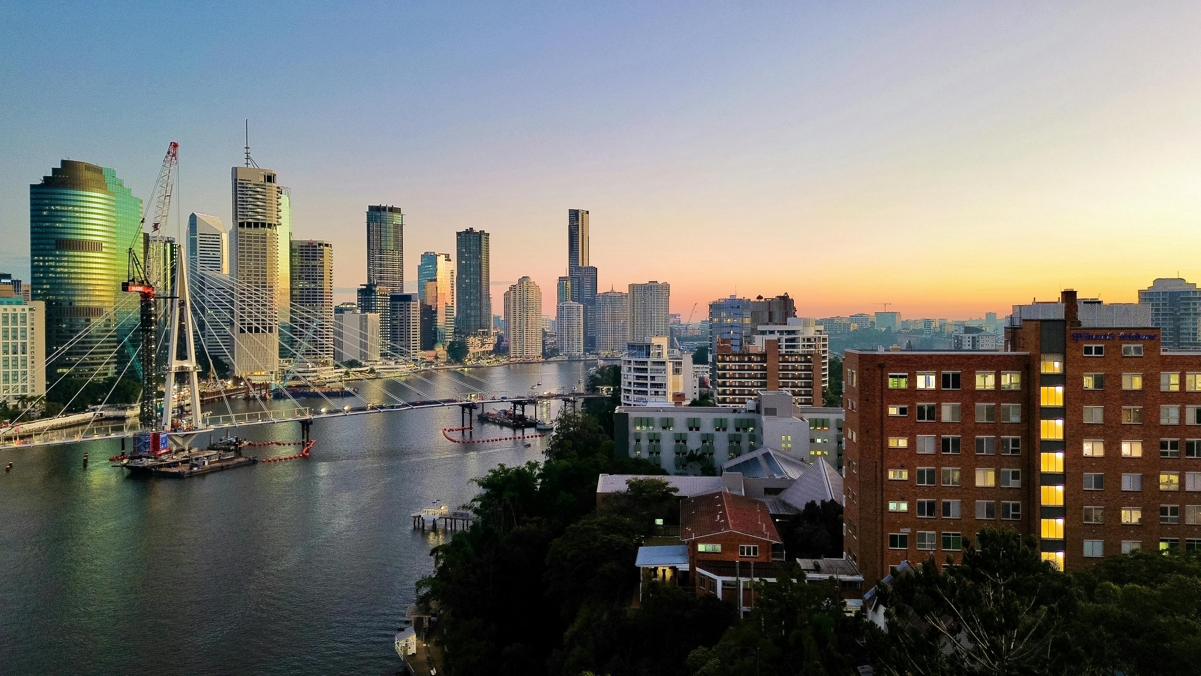 Brisbane city skyline along the river at dusk
